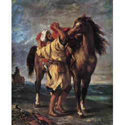 A moroccan saddling a horse