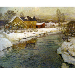 Cottage by a canal in the snow