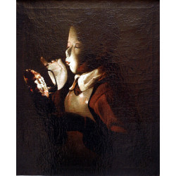 Boy blowing at lamp
